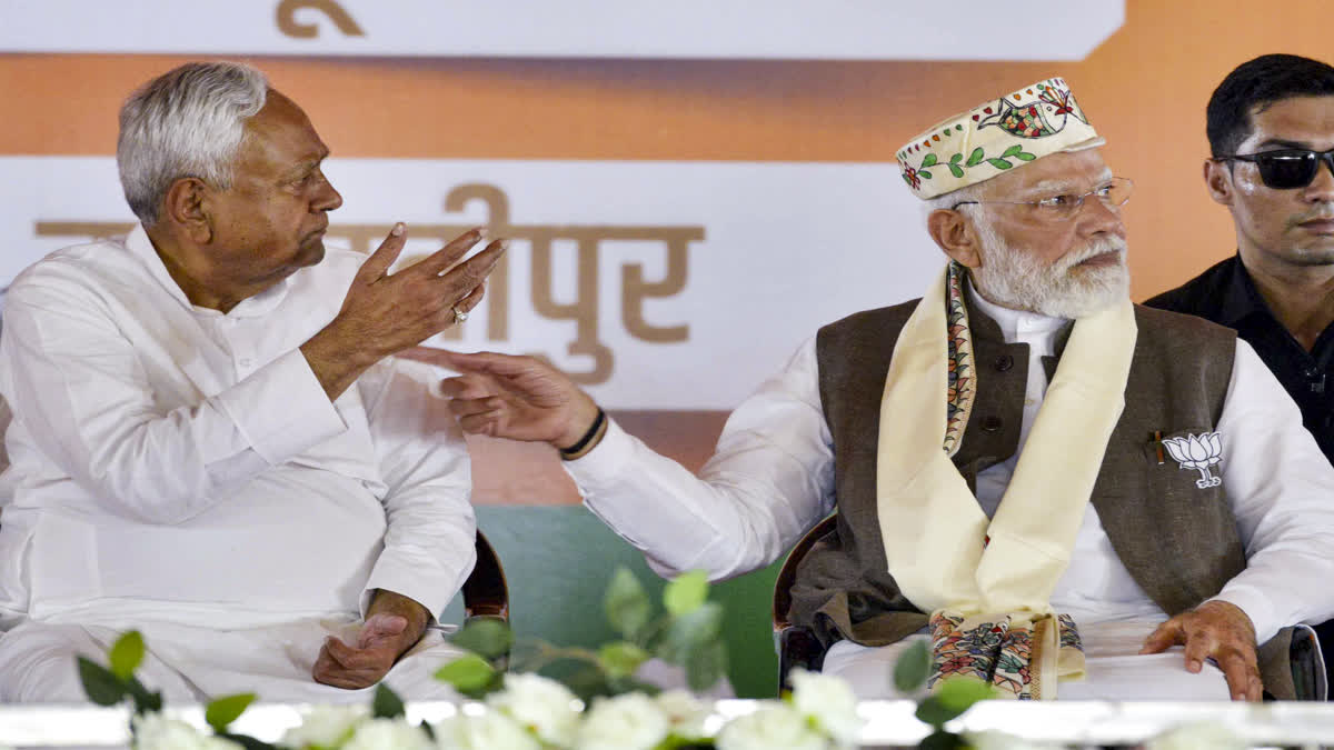 Prime Minister Narendra Modi, right, and Bihar Chief Minister Nitish Kumar during a public meeting ahead of the state Assembly elections, in Samastipur district, Friday, Oct. 24, 2025.