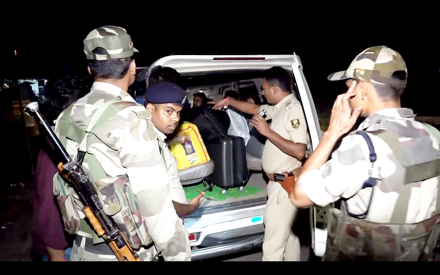 Security personnel check a vehicle amid increased security ahead of the first phase of Bihar Assembly elections.