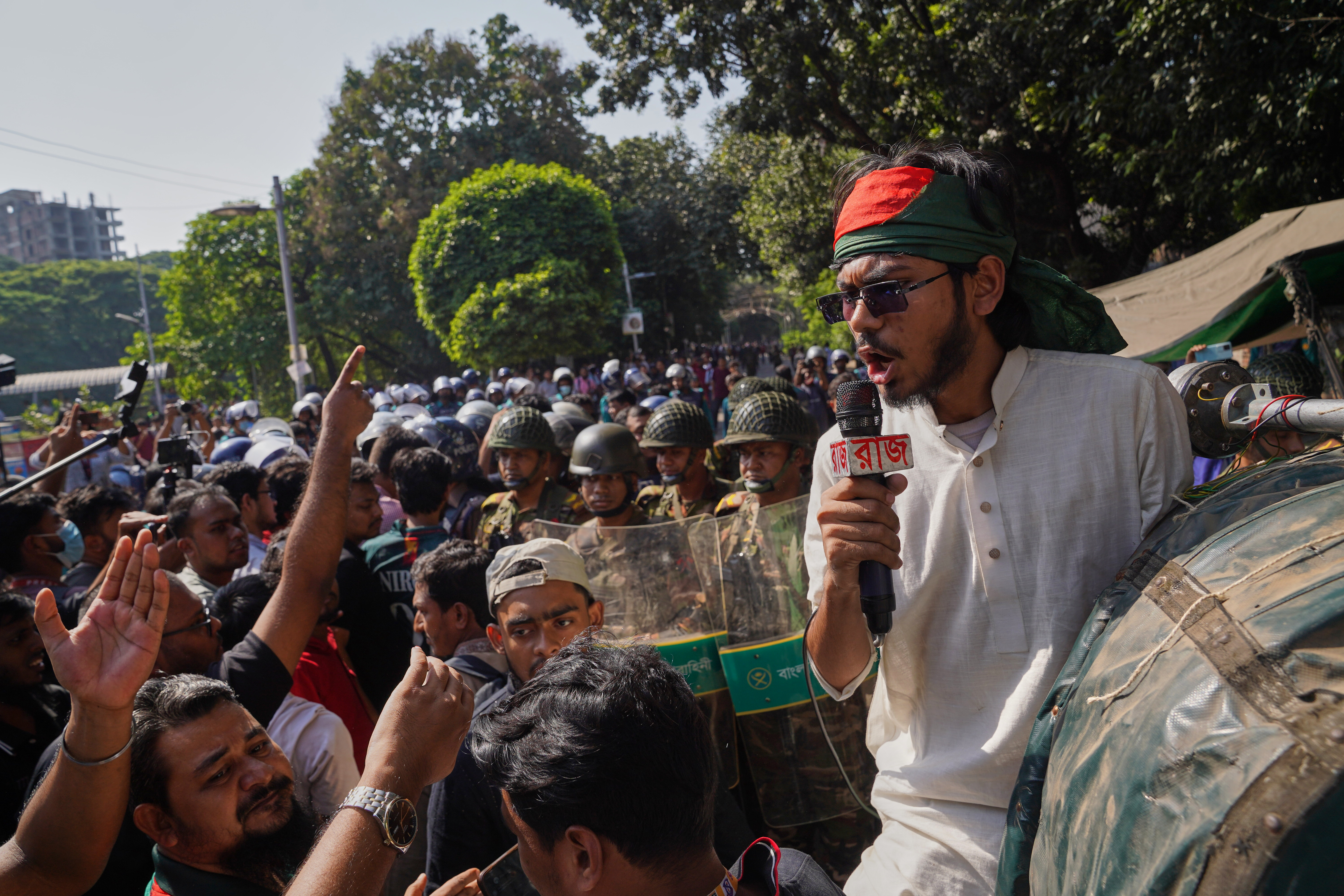 Protesters shout slogans outside the demolished residence of Sheikh Mujibur Rahman, Bangladesh's former leader and the father of the country's ousted Prime Minister Sheikh Hasina ahead of an expected verdict against Hasina, in Dhaka, Bangladesh, Monday, Nov. 17, 2025.