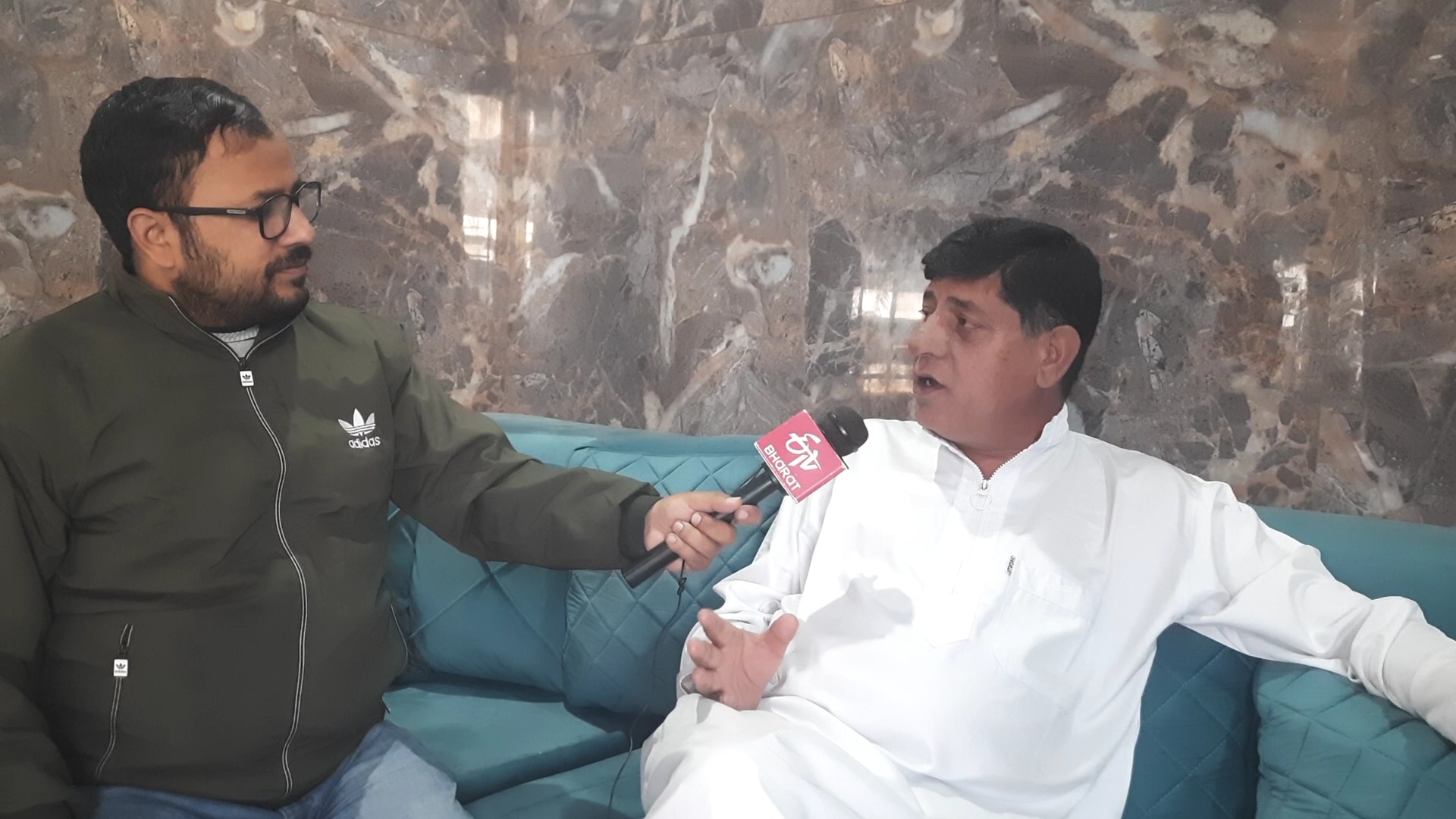 PDP General Secretary Imtiyaz Shan(R) in conversation with ETV Bharat correspondent Mohd Ashraf Ganie