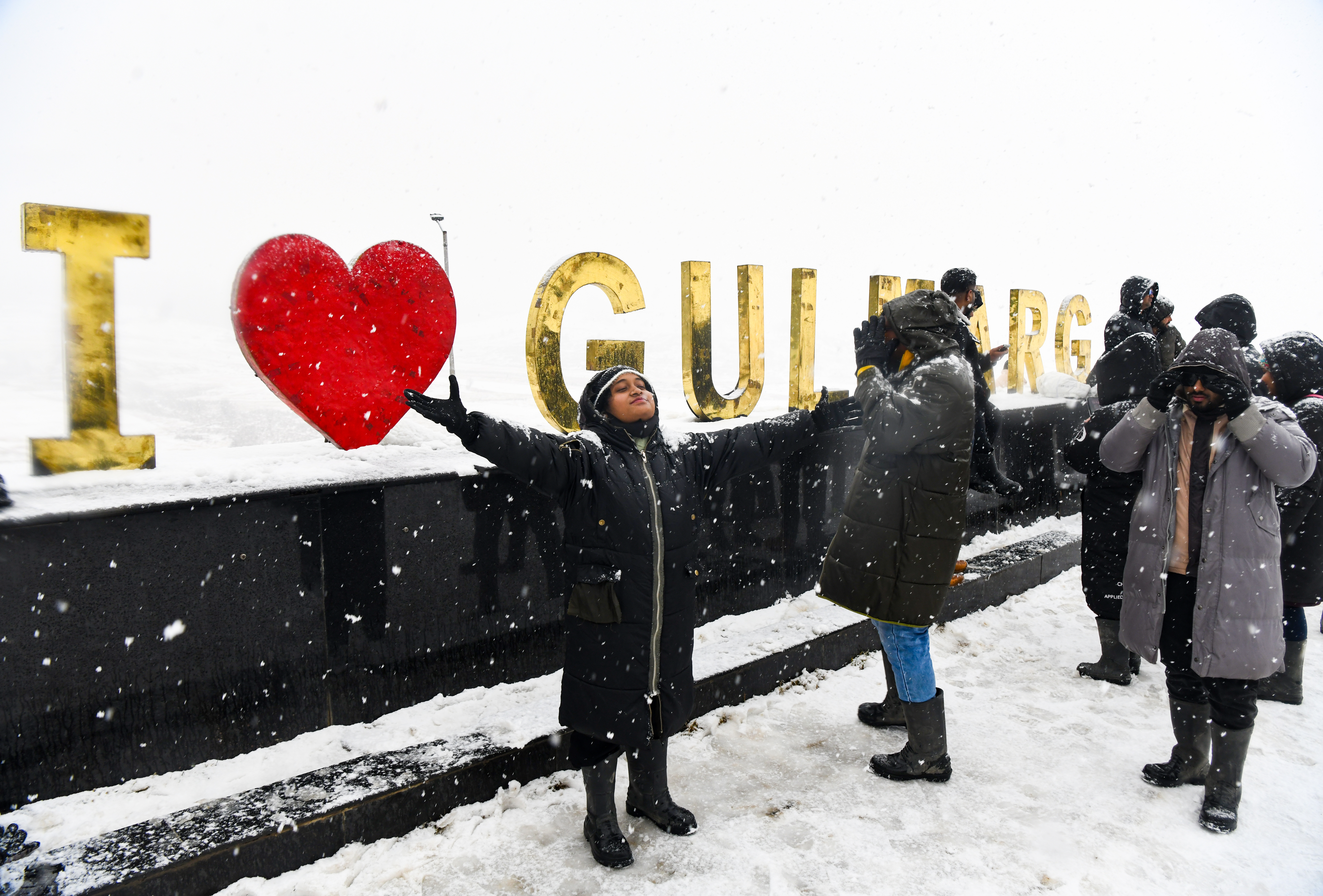 Tourists enjoy fresh snowfall at Gulmarg, Jammu and Kashmir