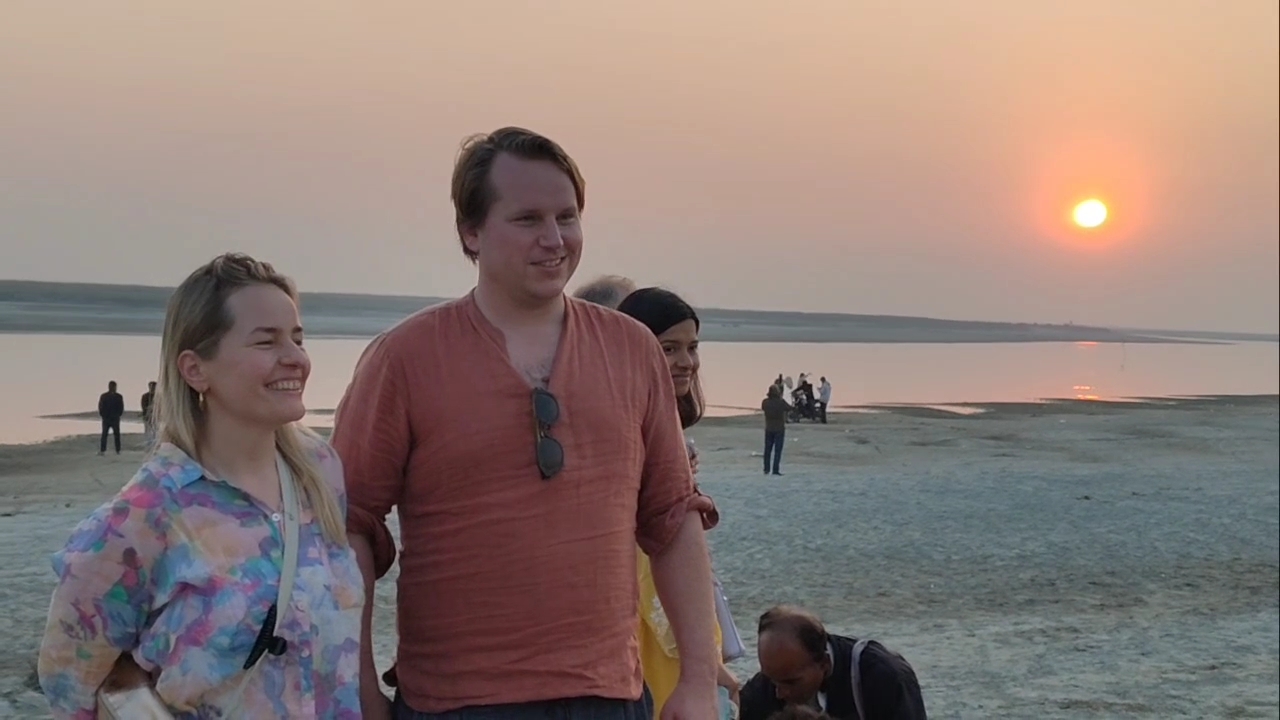 tourist mesmerized by the beauty of the sunset over the Brahmaputra