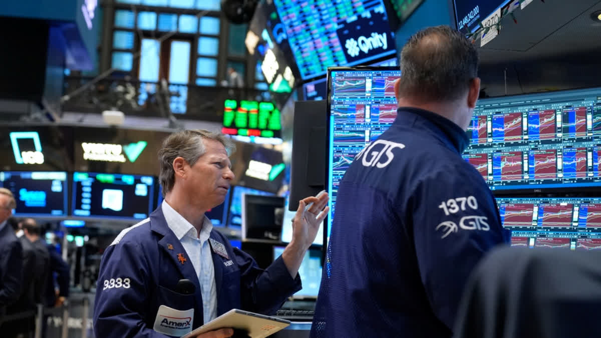 Bobby Charmak works on the floor at the New York Stock Exchange in New York, Monday, March 30, 2026.