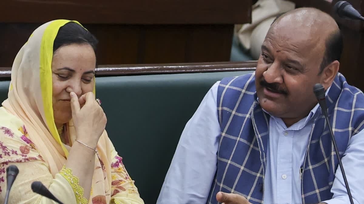 Jammu and Kashmir Health Minister Sakina Itoo(L) with Deputy Chief Minister Surinder Kumar Choudhary inside legislative assembly