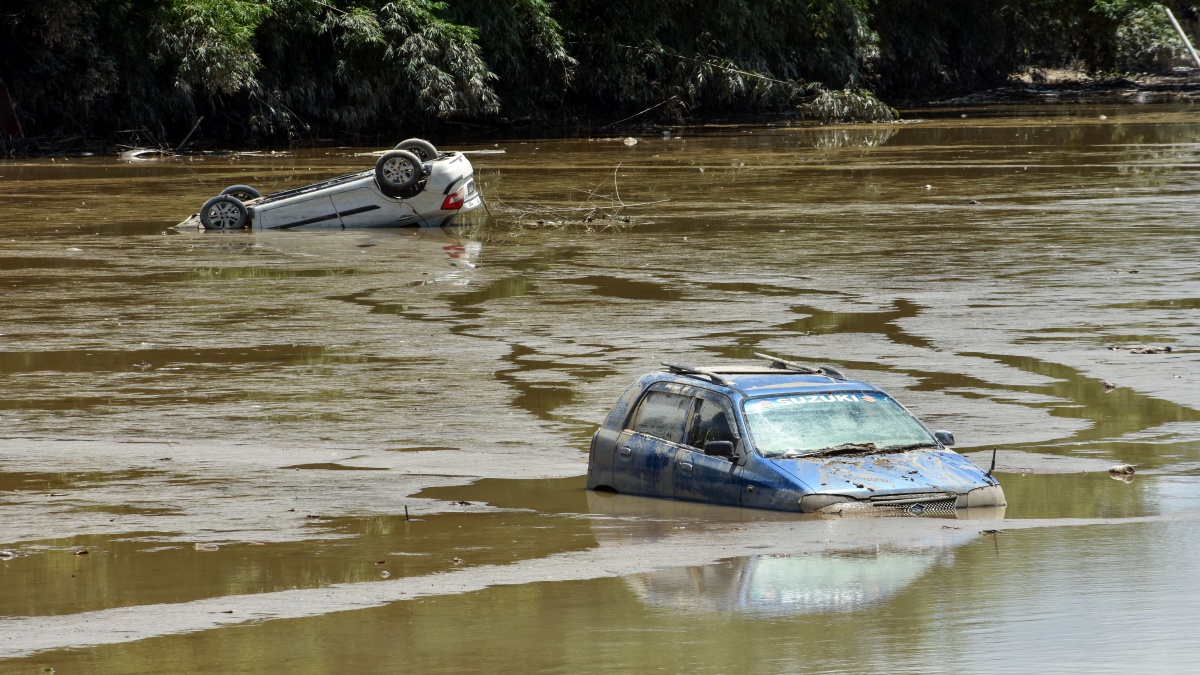 Cars submerged in water due to flood.