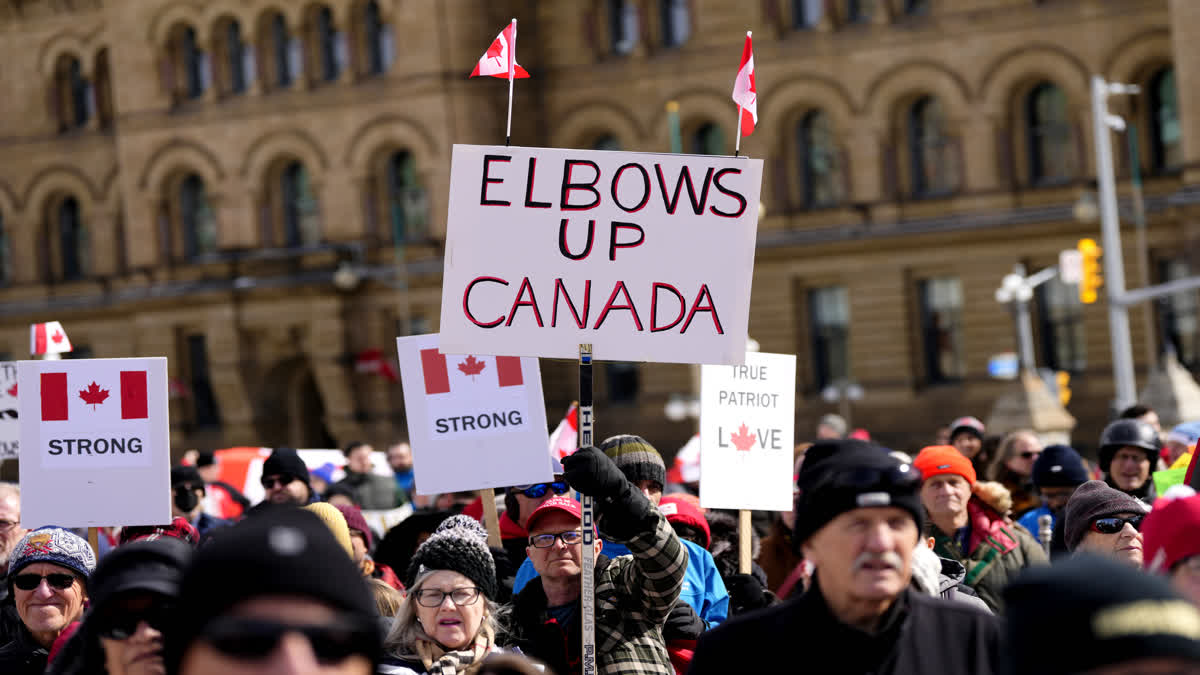 People rally in response to US President Donald Trump's threats to Canadian sovereignty on Parliament Hill in Ottawa in 2025.