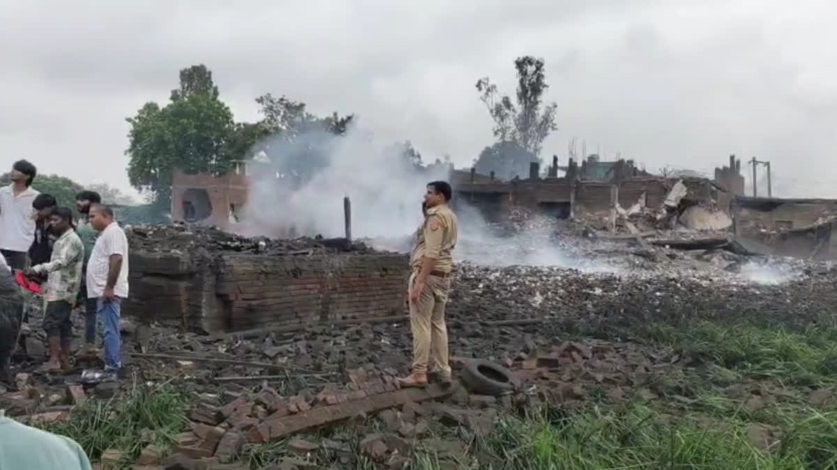 Police at the site of a massive explosion at a firecracker warehouse in Kaushambi, Uttar Pradesh.