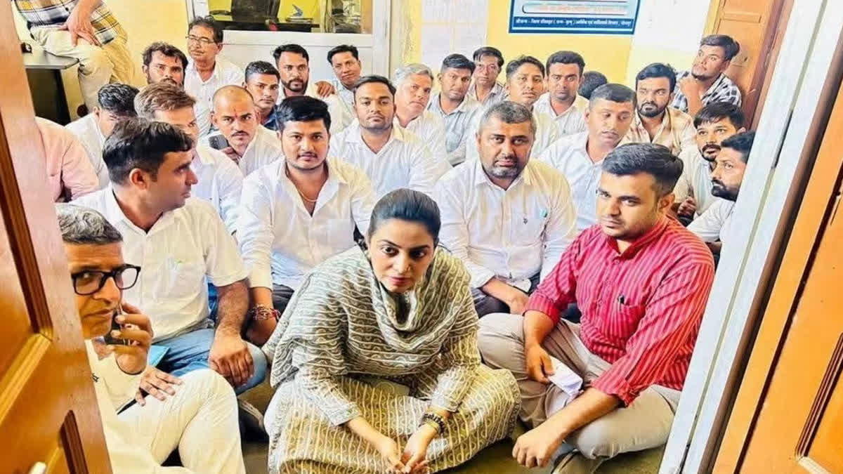 Former MLA Divya sitting on a sit-in protest
