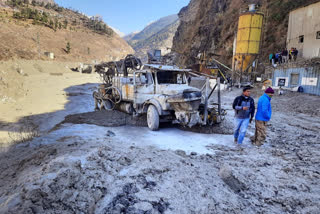 This frame grab from video provided by KK Productions shows a massive flood of water, mud and debris flowing at Chamoli District